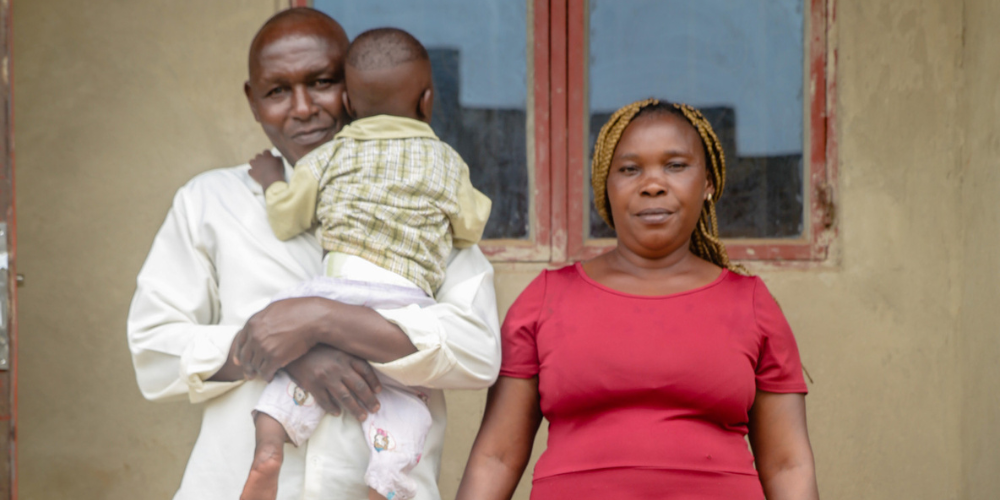 Uganda foster carers holding child