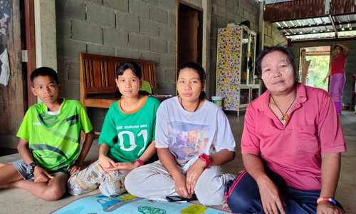 Kinship carer with three children in Thailand