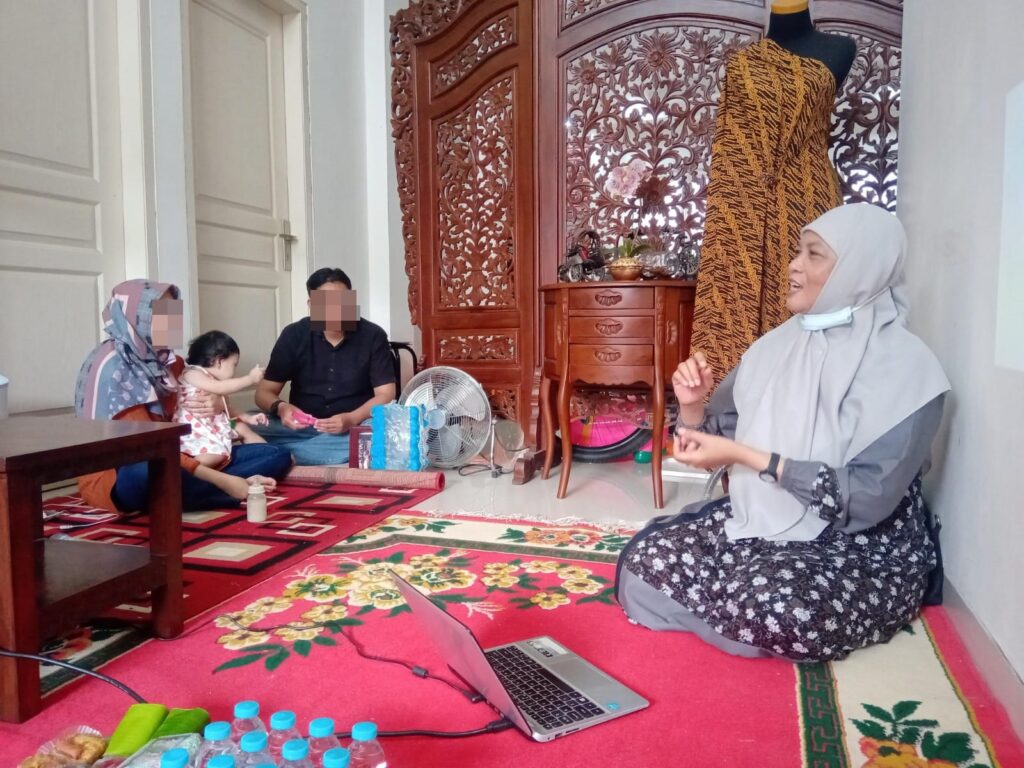 Family and Child Counsellor meeting with family in Indonesia