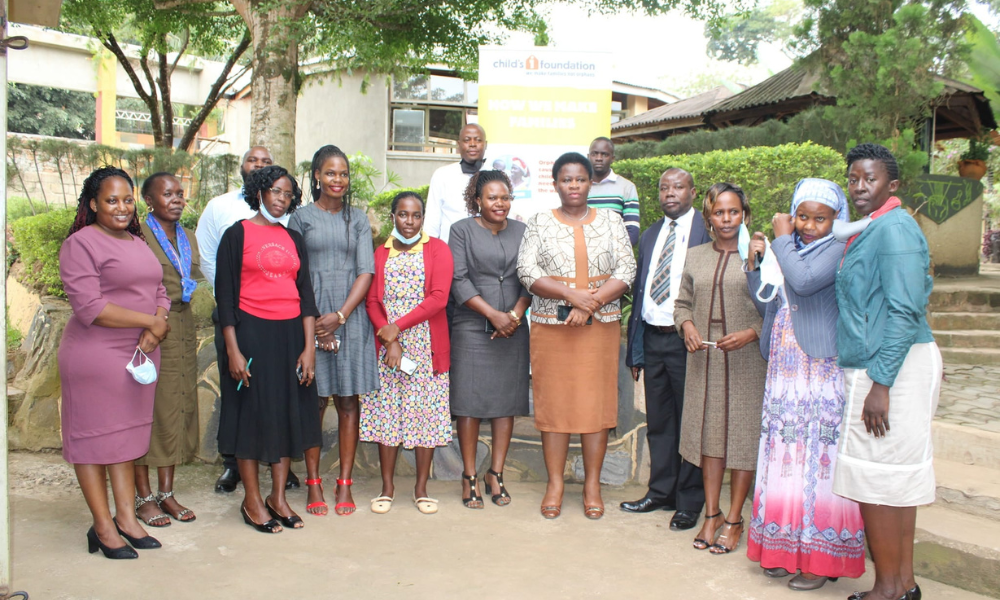 Group of local government officials in Uganda meeting about foster care